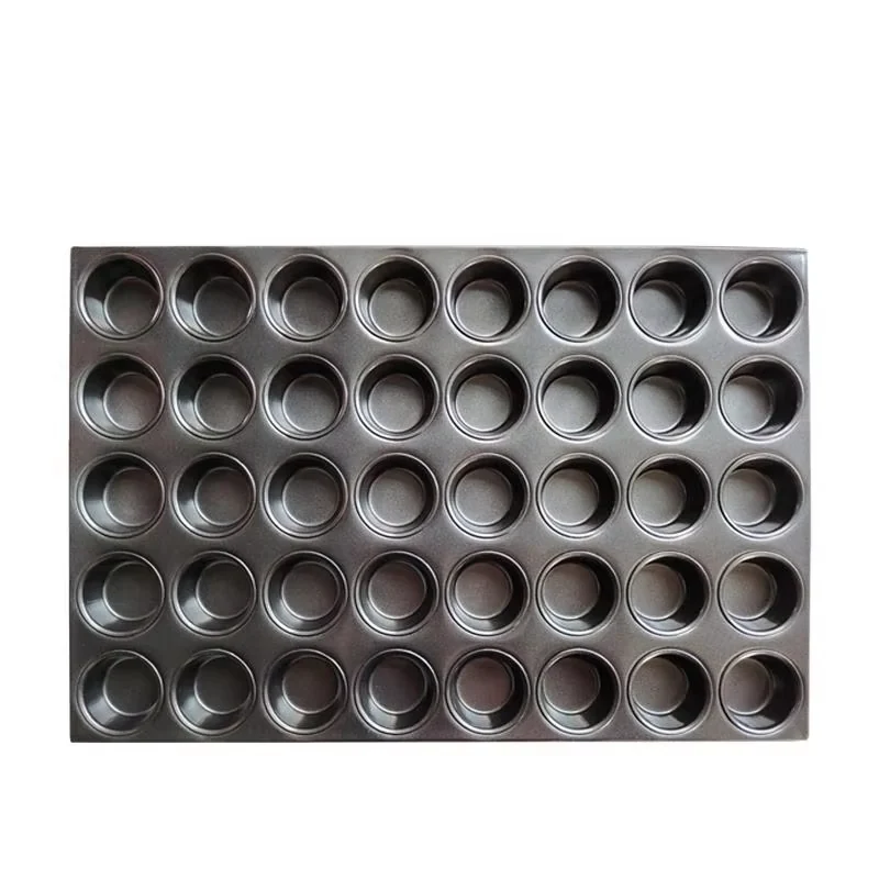 Commercial multi-cavity muffin baking pan on a clean white background